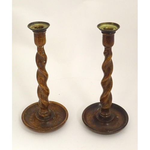 1362 - A pair of late 19th / early 20thC candlesticks with barley twist columns. Approx. 11 3/4