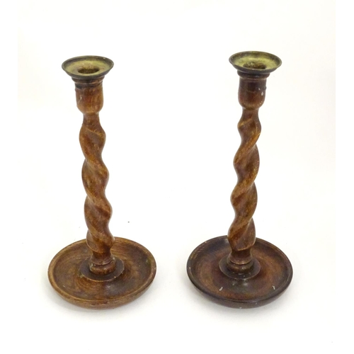 1362 - A pair of late 19th / early 20thC candlesticks with barley twist columns. Approx. 11 3/4