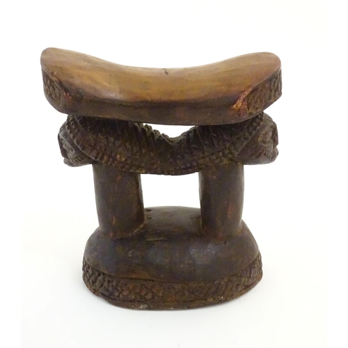 1476 - Ethnographic / Native / Tribal : A carved African headrest with figural supports. Approx. 8