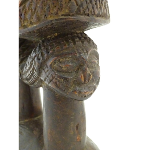 1476 - Ethnographic / Native / Tribal : A carved African headrest with figural supports. Approx. 8