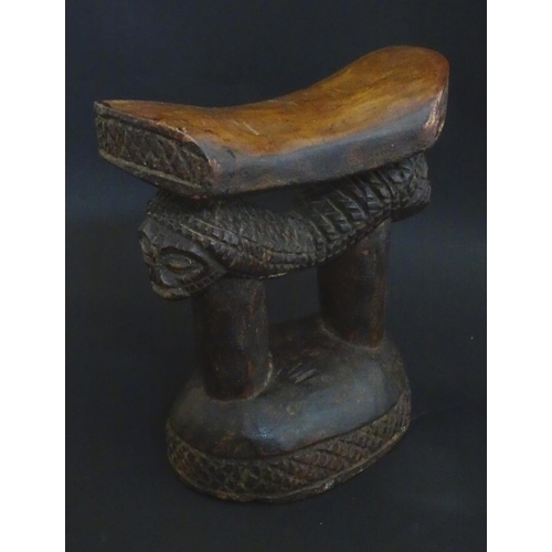 1476 - Ethnographic / Native / Tribal : A carved African headrest with figural supports. Approx. 8