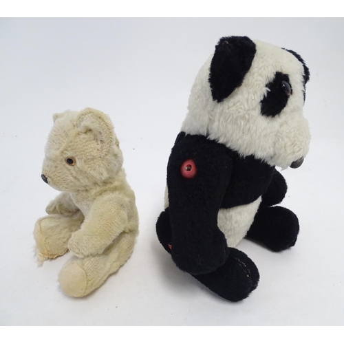 1486 - Toys: Two 20thC bears, comprising a panda bear with button jointed limbs, and a straw filled teddy b... 