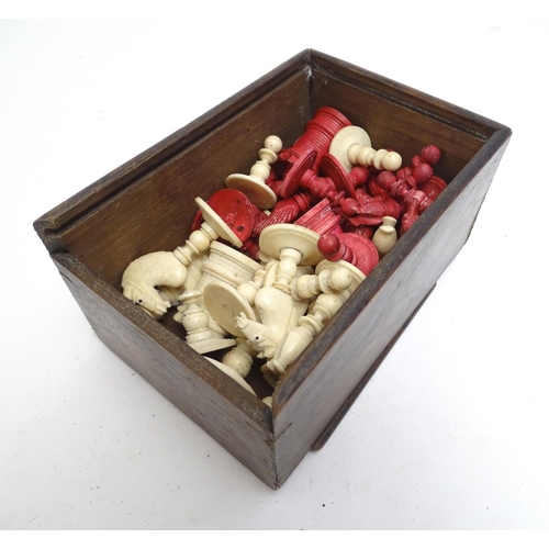 1487 - Toys: A 19thC / early 20thC set of turned and carved bone chess pieces, the largest approx. 4