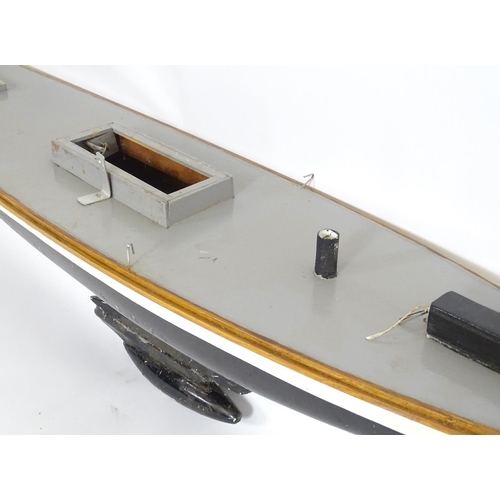 1519 - Toy: A 20thC scratch built wooden model of a boat with polychrome decoration. Approx. 60