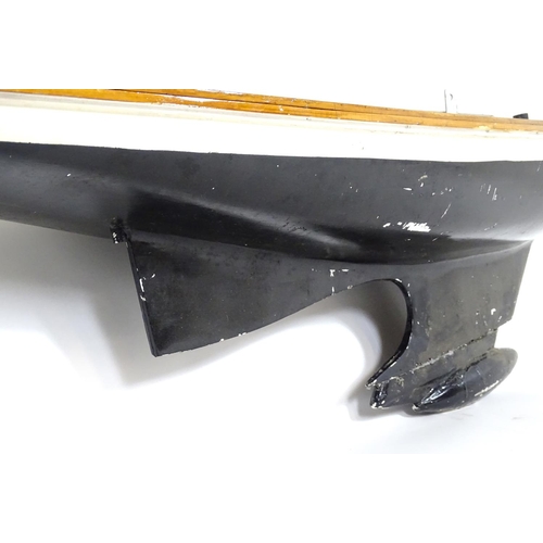 1519 - Toy: A 20thC scratch built wooden model of a boat with polychrome decoration. Approx. 60