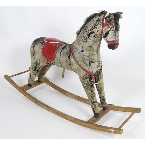 1526 - Toy: A 20thC plush rocking horse on bows with red and white saddle and reins. Approx. 38