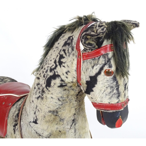 1526 - Toy: A 20thC plush rocking horse on bows with red and white saddle and reins. Approx. 38