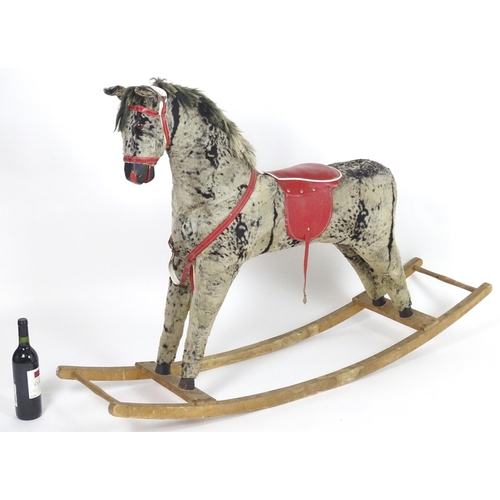 1526 - Toy: A 20thC plush rocking horse on bows with red and white saddle and reins. Approx. 38