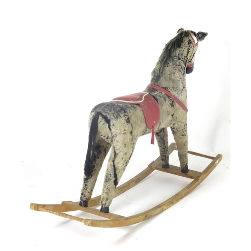 1526 - Toy: A 20thC plush rocking horse on bows with red and white saddle and reins. Approx. 38