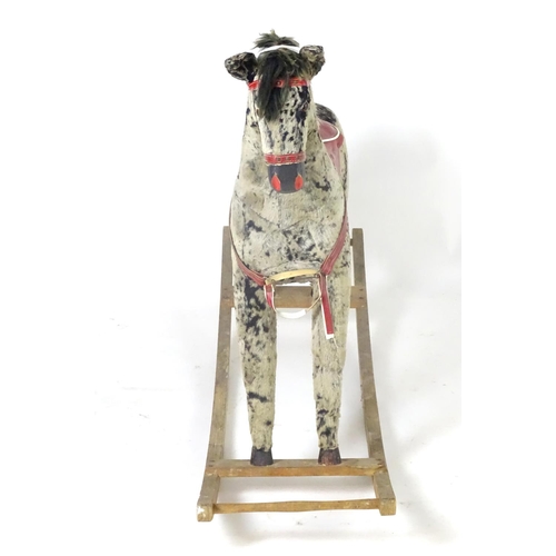 1526 - Toy: A 20thC plush rocking horse on bows with red and white saddle and reins. Approx. 38