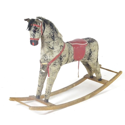 1526 - Toy: A 20thC plush rocking horse on bows with red and white saddle and reins. Approx. 38