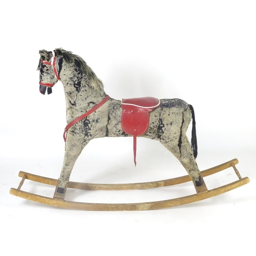 1526 - Toy: A 20thC plush rocking horse on bows with red and white saddle and reins. Approx. 38