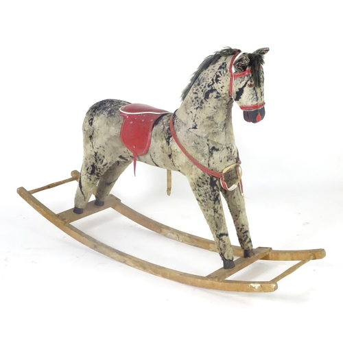 1526 - Toy: A 20thC plush rocking horse on bows with red and white saddle and reins. Approx. 38