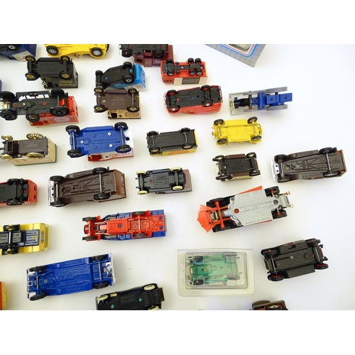 1527 - Toys: A large quantity of assorted die cast scale model cars / vehicles to include, advertising Matc... 