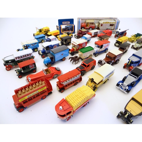 1527 - Toys: A large quantity of assorted die cast scale model cars / vehicles to include, advertising Matc... 