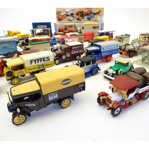 1527 - Toys: A large quantity of assorted die cast scale model cars / vehicles to include, advertising Matc... 