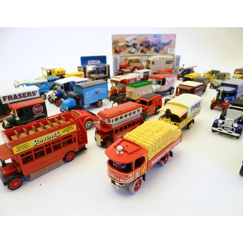 1527 - Toys: A large quantity of assorted die cast scale model cars / vehicles to include, advertising Matc... 