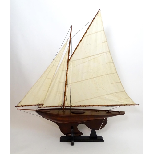 1531 - A 20thC model / pond yacht / boat of large proportions, carvel constructed from mahogany planks with... 