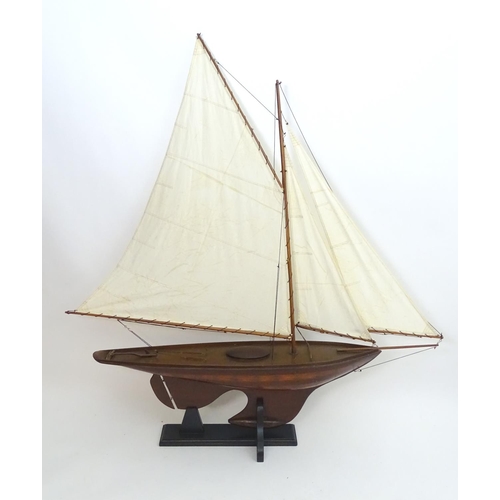 1531 - A 20thC model / pond yacht / boat of large proportions, carvel constructed from mahogany planks with... 