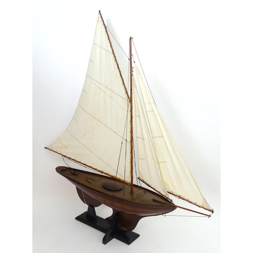 1531 - A 20thC model / pond yacht / boat of large proportions, carvel constructed from mahogany planks with... 