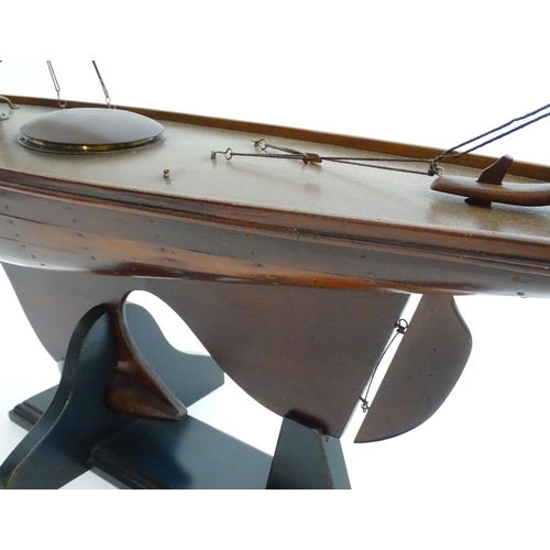 1531 - A 20thC model / pond yacht / boat of large proportions, carvel constructed from mahogany planks with... 