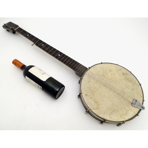 1542 - Musical Instruments: Early to mid 20thC Banjo. Having an open back steel body and set up for 5 strin... 