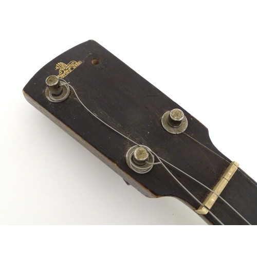 1542 - Musical Instruments: Early to mid 20thC Banjo. Having an open back steel body and set up for 5 strin... 