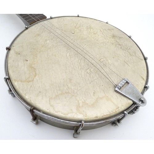 1542 - Musical Instruments: Early to mid 20thC Banjo. Having an open back steel body and set up for 5 strin... 