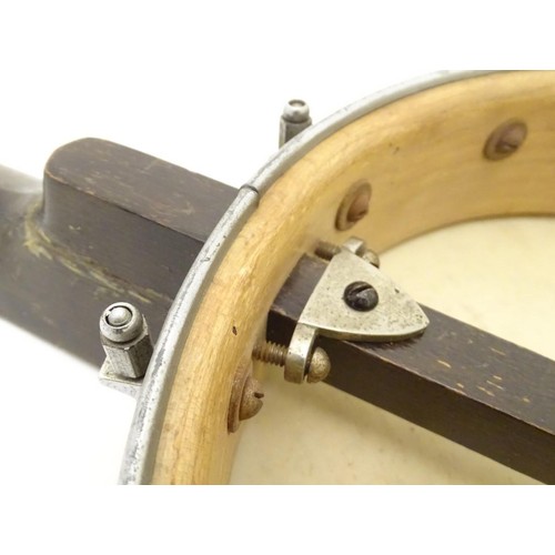 1542 - Musical Instruments: Early to mid 20thC Banjo. Having an open back steel body and set up for 5 strin... 