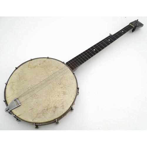 1542 - Musical Instruments: Early to mid 20thC Banjo. Having an open back steel body and set up for 5 strin... 