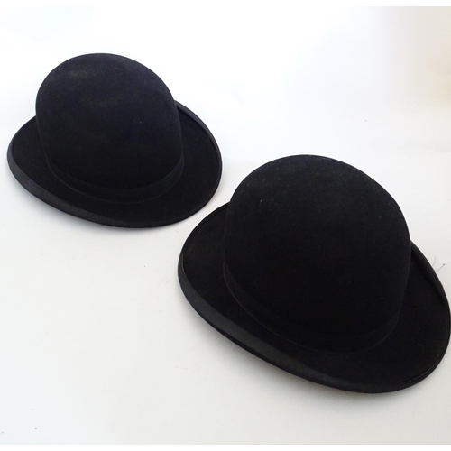 1555 - Two vintage black bowler hats, size 7 and size 12. One impressed to inner rim The Ideal, the other i... 