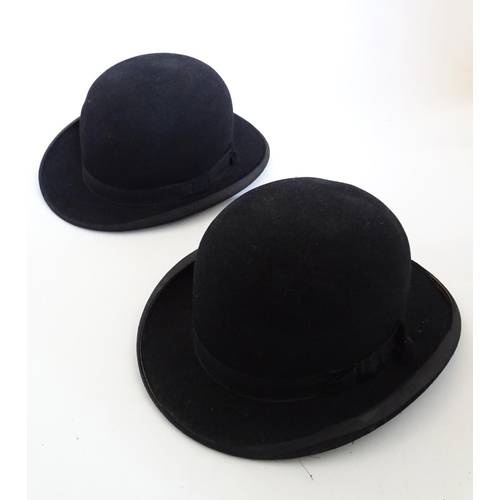 1555 - Two vintage black bowler hats, size 7 and size 12. One impressed to inner rim The Ideal, the other i... 