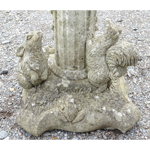 1585 - Garden & Architectural, Salvage: a pair of 20thC reconstituted stone statues formed as cherubs atop ... 