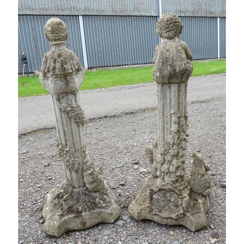 1585 - Garden & Architectural, Salvage: a pair of 20thC reconstituted stone statues formed as cherubs atop ... 