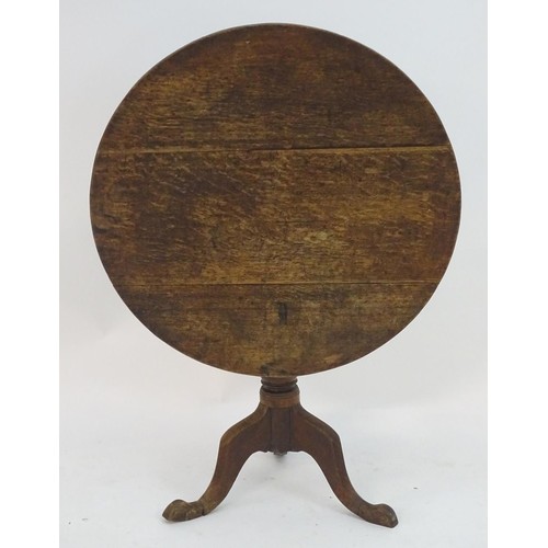 2085 - A late 18thC oak tripod table with a three plank top above a turned pedestal and three cabriole legs... 