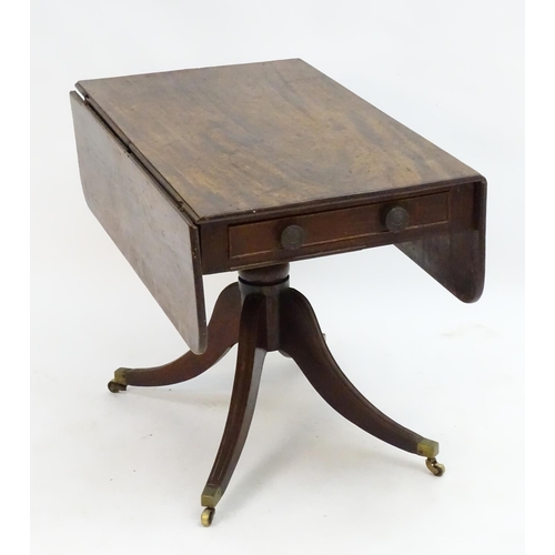 2096 - A mid 19thC mahogany Pembroke table with a rectangular top flanked by drop flaps to each side, havin... 