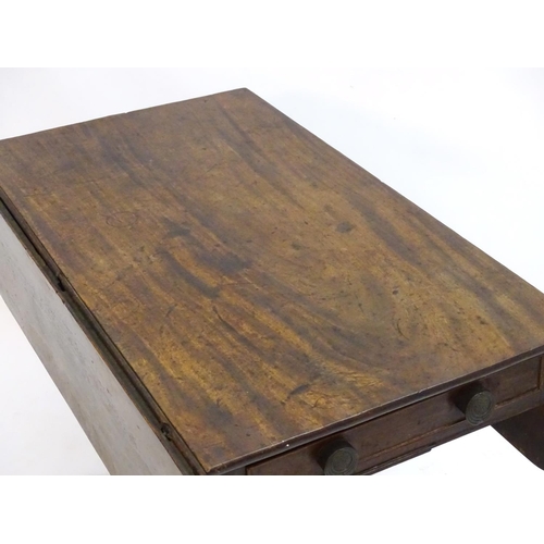 2096 - A mid 19thC mahogany Pembroke table with a rectangular top flanked by drop flaps to each side, havin... 