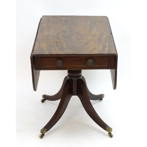 2096 - A mid 19thC mahogany Pembroke table with a rectangular top flanked by drop flaps to each side, havin... 