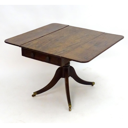 2096 - A mid 19thC mahogany Pembroke table with a rectangular top flanked by drop flaps to each side, havin... 