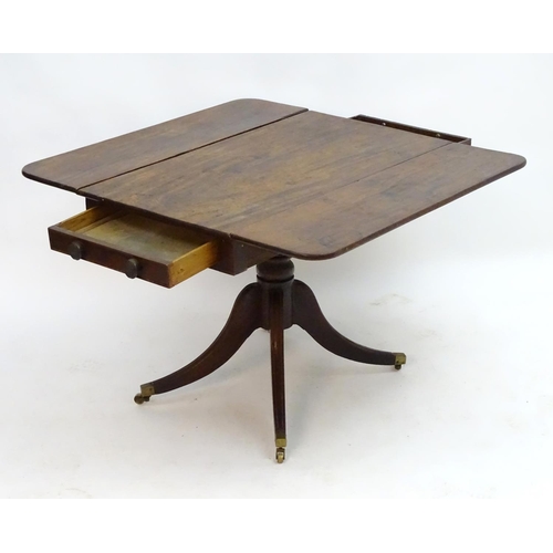 2096 - A mid 19thC mahogany Pembroke table with a rectangular top flanked by drop flaps to each side, havin... 