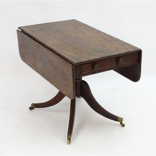 2096 - A mid 19thC mahogany Pembroke table with a rectangular top flanked by drop flaps to each side, havin... 