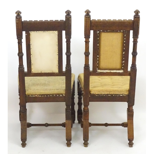 2098 - A pair of 19thC oak Gothic chairs, mounted by carved finials above incised frames with turned suppor... 