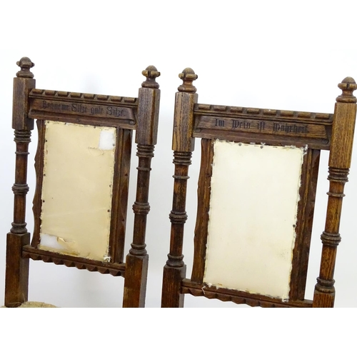 2098 - A pair of 19thC oak Gothic chairs, mounted by carved finials above incised frames with turned suppor... 