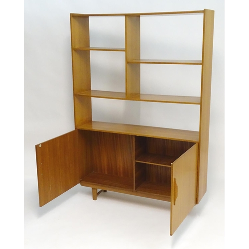 2211 - A Vintage / Retro teak room divider / cabinet with five shelves above two cupboards with shaped hand... 