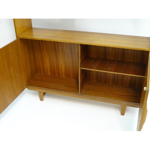 2211 - A Vintage / Retro teak room divider / cabinet with five shelves above two cupboards with shaped hand... 