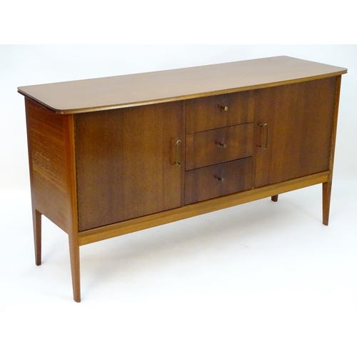 2212 - Vintage retro, Mid-century : Peter Hayward for W.G. Evans (Vanson). A 1950s walnut sideboard fitted ... 