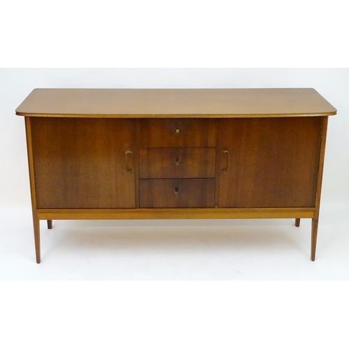 2212 - Vintage retro, Mid-century : Peter Hayward for W.G. Evans (Vanson). A 1950s walnut sideboard fitted ... 