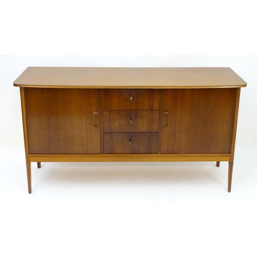 2212 - Vintage retro, Mid-century : Peter Hayward for W.G. Evans (Vanson). A 1950s walnut sideboard fitted ... 