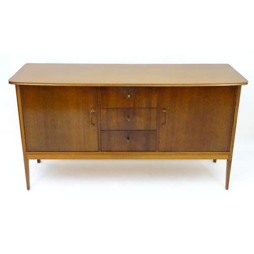 2212 - Vintage retro, Mid-century : Peter Hayward for W.G. Evans (Vanson). A 1950s walnut sideboard fitted ... 