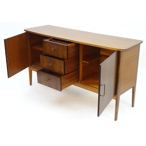 2212 - Vintage retro, Mid-century : Peter Hayward for W.G. Evans (Vanson). A 1950s walnut sideboard fitted ... 